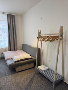 a bedroom with a bunk bed and a ladder at Penzion Pollet in Pilsen
