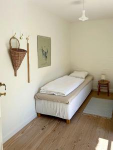 a bedroom with a bed in a room at Idyllic House By Mossø in Skanderborg