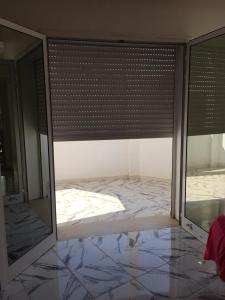 a room with a bed in a room with a window at Beautiful House in Tunis +29 photos