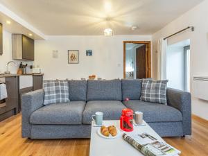 a living room with a couch and a table at Heron's Rest in Glendale +16 photos