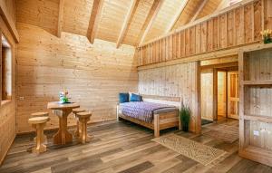 a wooden room with a bench and a table at Chalet In Stainz in Stainz