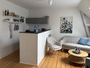 a living room with a couch and a table at Villa Friedenstraße 11 in Lüneburg