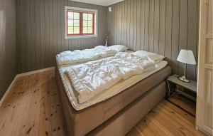 a large bed in a bedroom with a window at Gorgeous Home In Eggedal With Sauna in Eggedal