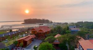 an aerial view of a resort with a beach at ML Homestay in Binh Chau