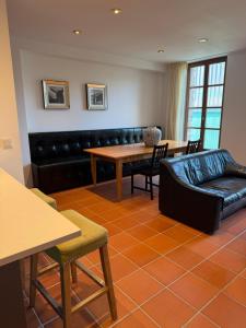 a living room with a couch and a table at Scheune B7 in Düsseldorf +6 photos