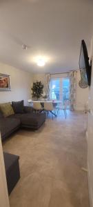 a living room with a couch and a table at The Mourne Nest in Newcastle