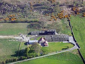 an aerial view of a large building in a field at Raby Cottage-27764 in Wolsingham +8 photos