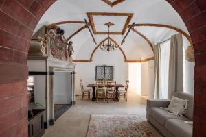 a living room with a couch and a table at Schloss Locarno - Suites & Apartments in Locarno