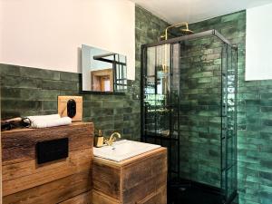 a bathroom with a sink and a shower at Dymer in Biskupiec +15 photos