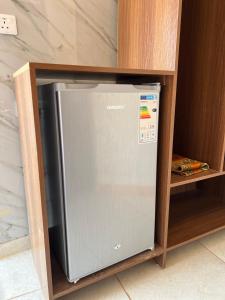 a small refrigerator in a shelf in a cabinet at MARTIAN LANDSCAPE lUXURY CAMP in Wadi Rum