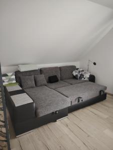 a couch in a room with a white wall at Apartment 28 in Stadthagen