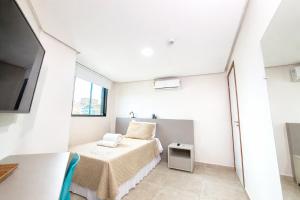 a small bedroom with a bed and a window at Hotel JD in Taquaritinga do Norte +22 photos