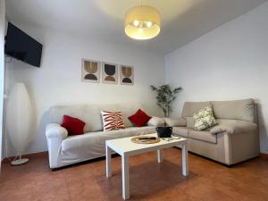 a living room with a couch and a table at La Paserina in Arenas de Cabrales