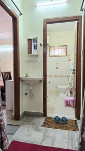 a bathroom with a sink and a toilet at Crystal Mansion in Hyderabad +13 photos