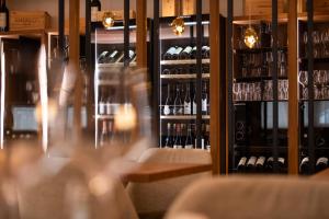 a room filled with lots of bottles of wine at Hotel Cristina Wellness Relax in Pinzolo