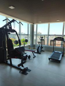 a gym with several exercise equipment in a building at San Pedro, Cristal INN in San Pedro