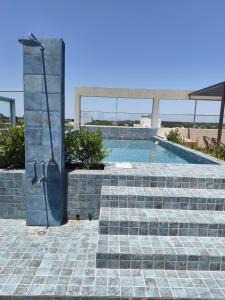 a set of stairs leading to a swimming pool at San Pedro, Cristal INN in San Pedro
