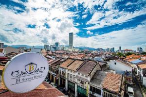 a view of the city from the roof of a building at B Street Hotel in George Town