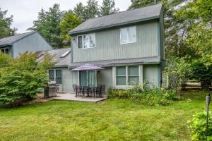 a green house with a table and chairs in the yard at On River Time Bring Your Pup Pool in Bartlett