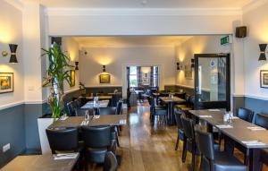 a dining room with tables and chairs at Ilkley Riverside Hotel in Ilkley +31 photos