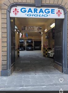 a garage with two cars parked inside of it at Renaissance Palace Noble Floor Apartment in Florence