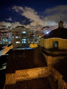 a view from the roof of a building at night at Plaza murillo in La Paz