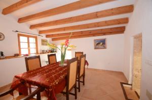 a dining room with a table and chairs at House Sant Jaume in Alcudia