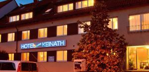 a hotel with a sign on the side of a building at Hotel Keinath Stuttgart in Stuttgart