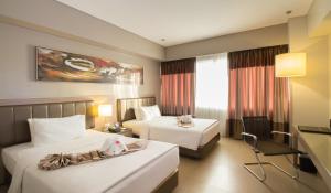 Voodi või voodid majutusasutuse Bayfront Hotel Cebu North Reclamation toas