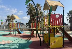 a playground at a park at ZEcamping 4 étoiles chiens acceptés piscine chauffée et toboggans in Portiragnes