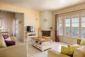 a living room with a couch and a table at Nikolas by Vintage Travel in Fiskardo