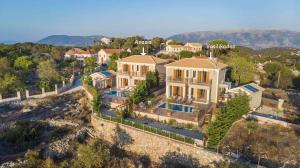 an aerial view of a house with a mountain at Vasilikades by Vintage Travel in Fiskardo