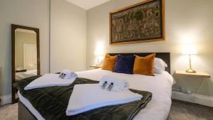 a hotel room with two beds with towels on them at Summers Nook in Humshaugh
