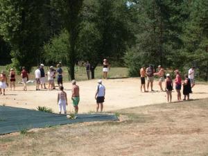 a group of people standing around in a park at ZEcamping 3 étoiles animaux acceptés tennis piscine et soirées animées in Pézuls +27 photos