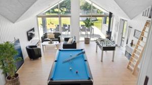 a pool table in the middle of a living room at Villavilla 596 - Rømø, Sydjylland in Høm