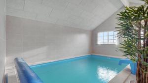 a swimming pool in a room with a ceiling at Villavilla 520 - Mommark, Sydjylland in Sarup