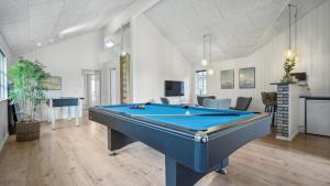 a living room with a pool table in it at Villavilla 520 - Mommark, Sydjylland in Sarup