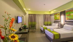 Postel nebo postele na pokoji v ubytování Bayfront Hotel Cebu North Reclamation + 36 fotografií