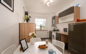 a kitchen with a table with a plate of food on it at BEGE APARTMENTS LoftWork in Lüdenscheid