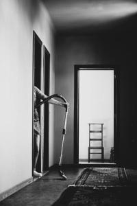 a room with a vacuum in front of a door at Rosario in Bever