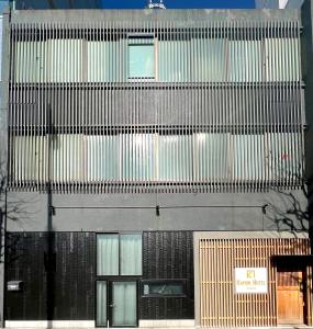 an overhead view of a tall building with many windows at Otemachi Kamon Hotel in Tokyo