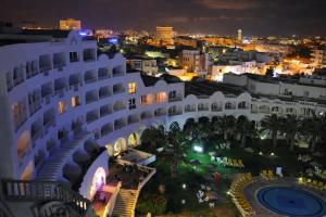 a view of a building at night at Hotel El Habib Monastir in Monastir