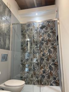 a bathroom with a shower with a toilet at Antico Borgo in Ancona