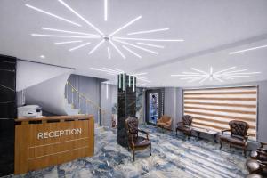 a waiting room with chairs and a reception desk at Kilic Boutique Hotel in Istanbul