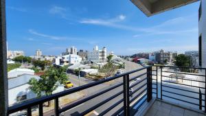 a balcony with a view of a city at Dongle B&B in Taitung City