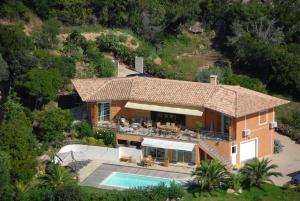 an aerial view of a house with a swimming pool at Villa Pierretti - Vue mer Panoramique in Coti-Chiavari +15 photos