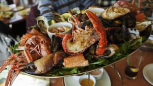 a plate of food with seafood on a table at ZEcamping 3 étoiles pet friendly piscine chauffée et piscine couverte in Audierne +19 photos
