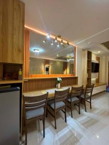 a dining room with a table and chairs at CEEJ Building Transient Studio Rooms in Iloilo City