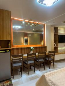 a dining room with a long table and chairs at CEEJ Building Transient Studio Rooms in Iloilo City