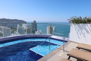 a swimming pool on the roof of a building at Rodadero Ocean View Luxury Apt with Rooftop Pool in Taganga